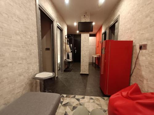 a kitchen with a red refrigerator in a room at OUH Candy Box in Bilbao