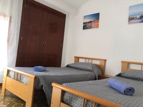 Postel nebo postele na pokoji v ubytování Casa de la playa