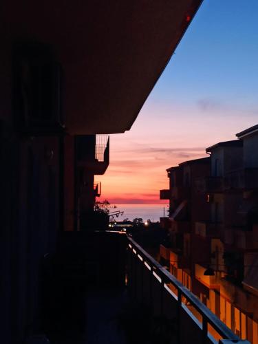 a sunset seen from a balcony of a building at La Casa Sicula in Capri Leone
