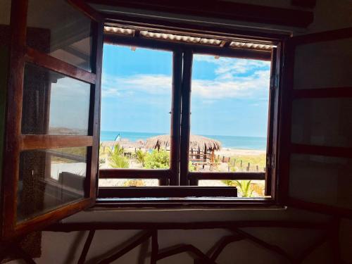 an open window with a view of the desert at Un Dia Boutique Resort in Playas
