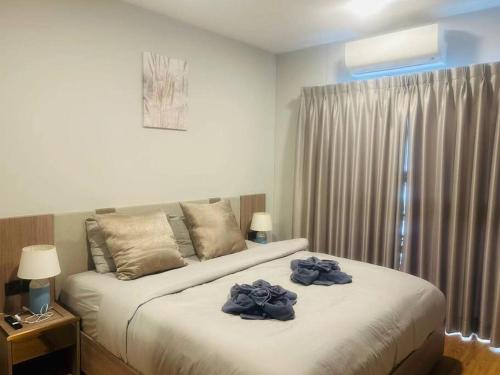 Ένα ή περισσότερα κρεβάτια σε δωμάτιο στο Astra Sky River Luxury 3B2B Condo
