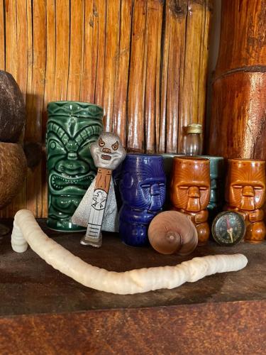 a group of different colored vases sitting on a shelf at Un Dia Boutique Resort in Playas