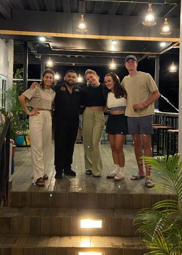 a group of people posing for a picture at Blasina Beer Hostel in Boquete