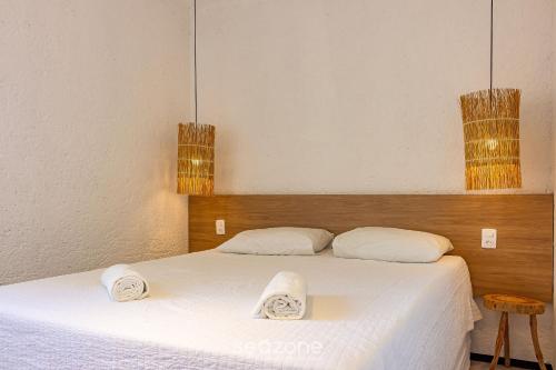Gulta vai gultas numurā naktsmītnē Apartamento Estiloso em Porto de Pedras CVPF102