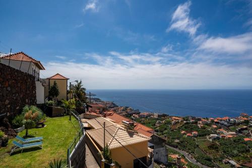 a view of the ocean from a house at Casa das Maravilhas by An Island Apart in Câmara de Lobos