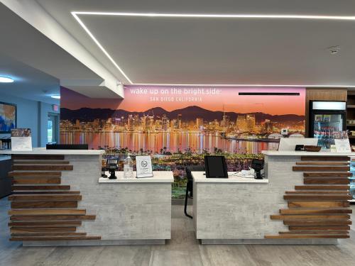 a store with a large mural of a city at La Quinta Inn by Wyndham San Diego - Miramar in Sabre Springs