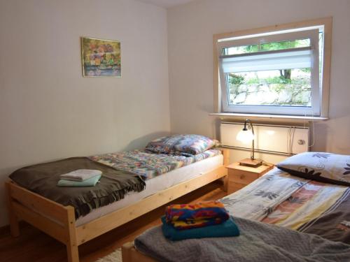 Llit o llits en una habitació de Holiday home in Zakowo