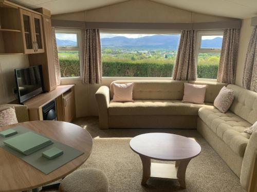 a living room with a couch and a table at Town View in Killarney