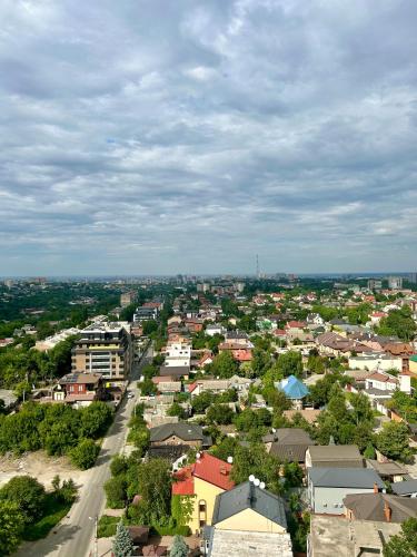 an aerial view of a city with buildings and a street at Apartments in Grani in Dnipro
