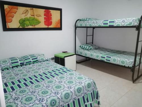 a bedroom with a bed and a bunk bed at Hotel Bellavista Isla del Sol in Prado