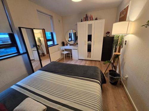 a bedroom with a bed and a desk in it at Prince's two in Dublin