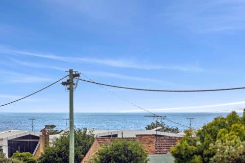 a view of the ocean from a house at Saltwater Serenity - Townhouse with a View in Torquay