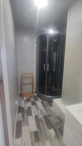 a bathroom with a large mirror in a room at Auxais memory 44' in Auxais