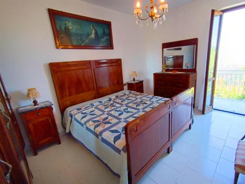 a bedroom with a bed and a dresser and a mirror at Casa Atana - a Tuscan gem in Licciana Nardi