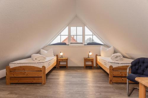 En eller flere senger på et rom på 50030 Ferienwohnung Nordwind