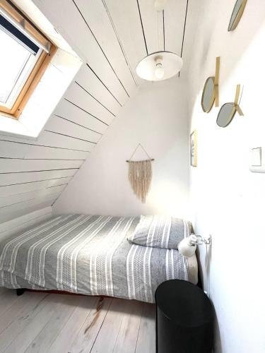 Ένα ή περισσότερα κρεβάτια σε δωμάτιο στο White and Sea Lodge