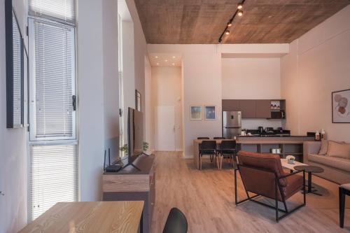 a living room with a couch and a table at Disfrutá Pilar Extraordinario Depto powered by Argenhost P28 in Manuel Alberti