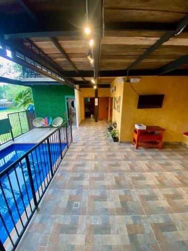 a view of a swimming pool from the balcony of a house at Coffee House Minca in Minca