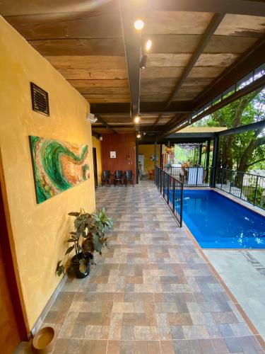 a hallway with a pool in a building at Coffee House Minca in Minca