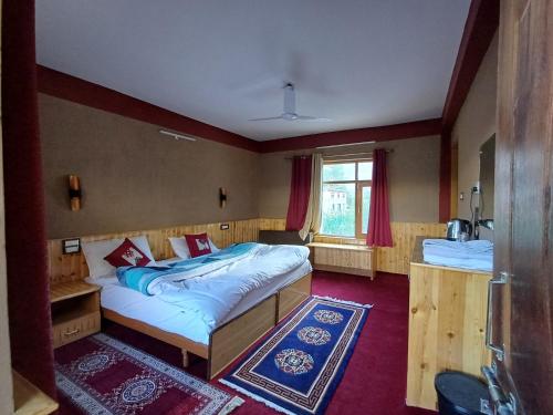 Postel nebo postele na pokoji v ubytování Kunzom Inn Tabo