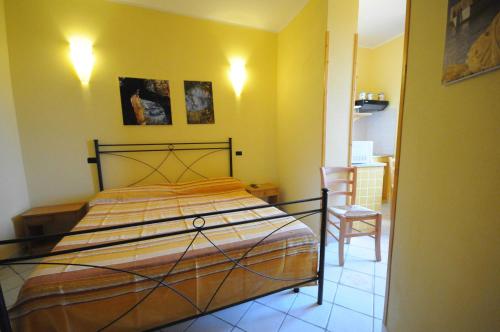 Łóżko lub łóżka w pokoju w obiekcie Residence - Torre Del Sole