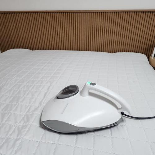 a computer mouse sitting on top of a bed at Stay Banwoldang in Daegu