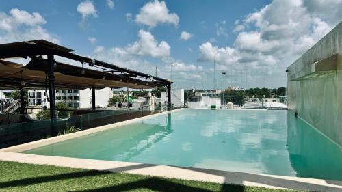 a swimming pool on the roof of a building at Hotel Noah Tulum in Tulum