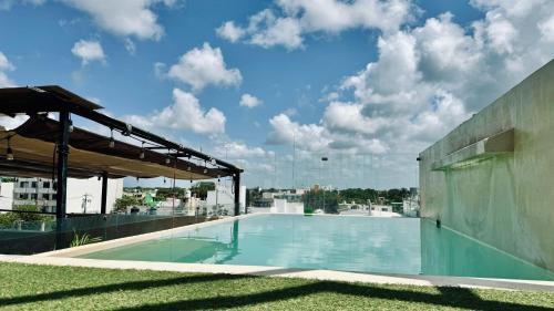 a swimming pool on the roof of a building at Hotel Noah Tulum in Tulum