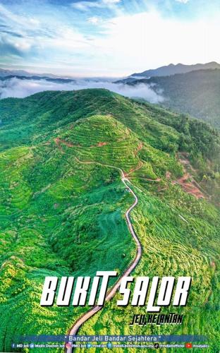 a poster of a mountain with a road on it at Homestay Jeli - Cattleya Inn Muslim in Jeli