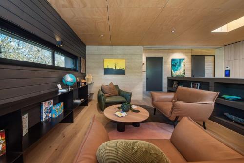 a living room with a couch and chairs and a table at Atlas Retreat in Shoreham