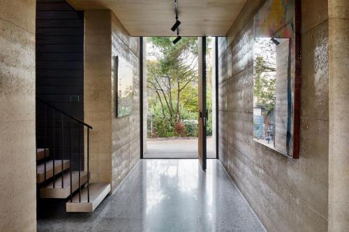 a hallway of a house with a glass door at Atlas Retreat in Shoreham