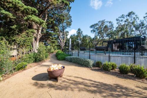 a fire pit sitting in the middle of a dirt road at Atlas Retreat in Shoreham