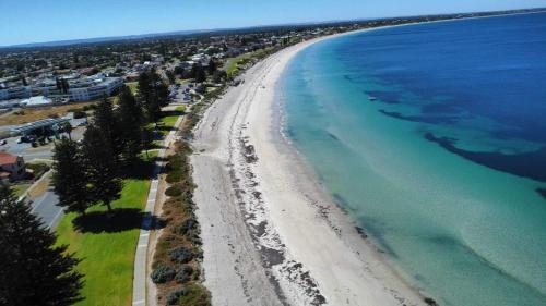 an aerial view of a beach and the ocean at Surfside Sunset in Safety Bay