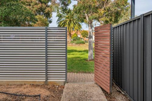 a gate to a fence with at Churchill Condo in Prospect