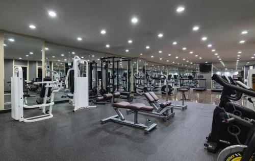 a gym with lots of treadmills and machines at Kensington Hotel Pyeongchang in Pyeongchang 