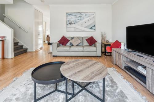 a living room with a table and a couch at Churchill Condo in Prospect