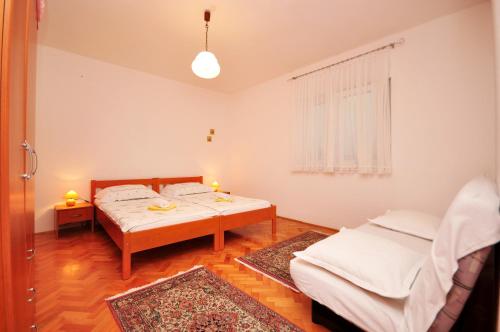 Posteľ alebo postele v izbe v ubytovaní Apartments Ivan