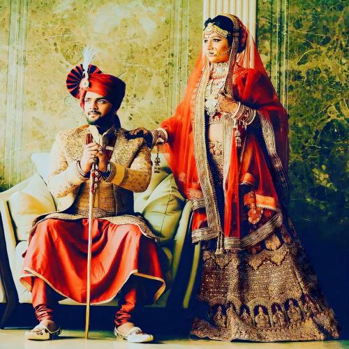 a man and a woman sitting next to each other at DESERT OVERNIGHT LUXURY CAMP & ReSORT in Jaisalmer