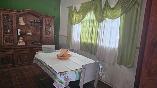 a room with a table with a bowl on it at Hostel Sol e Luar in Franca