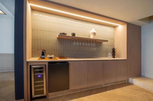 a kitchen with a sink and a counter at Camino Real Polanco Mexico in Mexico City