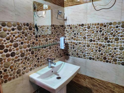 a bathroom with a sink and a shower at RS Homestay - A Pleasant Stay in Theog