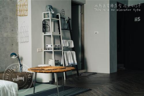 a table with cookies on it in a room at Wuhoo House in Kaohsiung