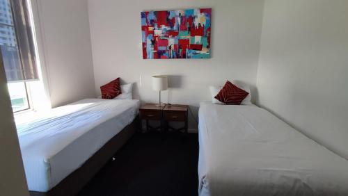 Katil atau katil-katil dalam bilik di South Yarra Central Apartment Hotel