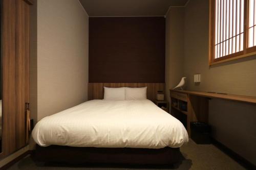 HOTEL CUORE Kyoto Shijo Omiyaにあるベッド