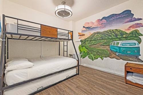 a bedroom with a mural of a bus on the wall at Howzit Hostels in Wailuku
