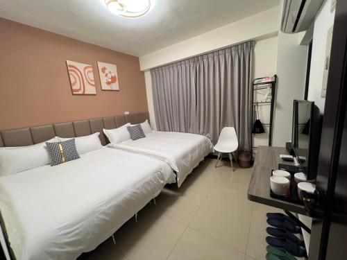 Ένα ή περισσότερα κρεβάτια σε δωμάτιο στο Haoyue Hotel