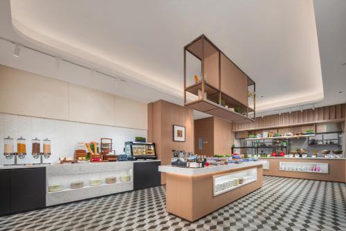 a large kitchen with aasteryasteryasteryasteryasteryasteryasteryasteryasteryasteryastery at Holiday Inn Express Beijing Zhongguancun Tech Park by IHG l Next to The Old Summer Palace & Beijing Sport University l Taxi 10 Minutes to Summer Palace & Peking University & Tsinghua University in Beijing