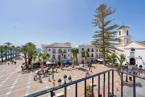 a view of a town square with people and buildings at Balcon de Europa in Nerja by Solaga Holiday Homes in Nerja