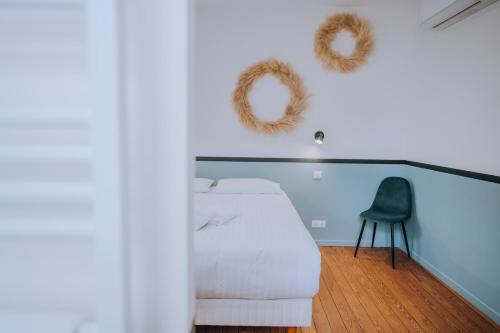 Ένα ή περισσότερα κρεβάτια σε δωμάτιο στο La Marjolaine - Demeure d'Hotes - Service Para-hôteIier - Premium