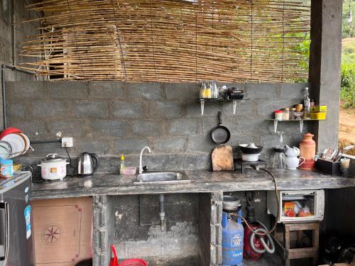 A kitchen or kitchenette at Backpackers Hostel